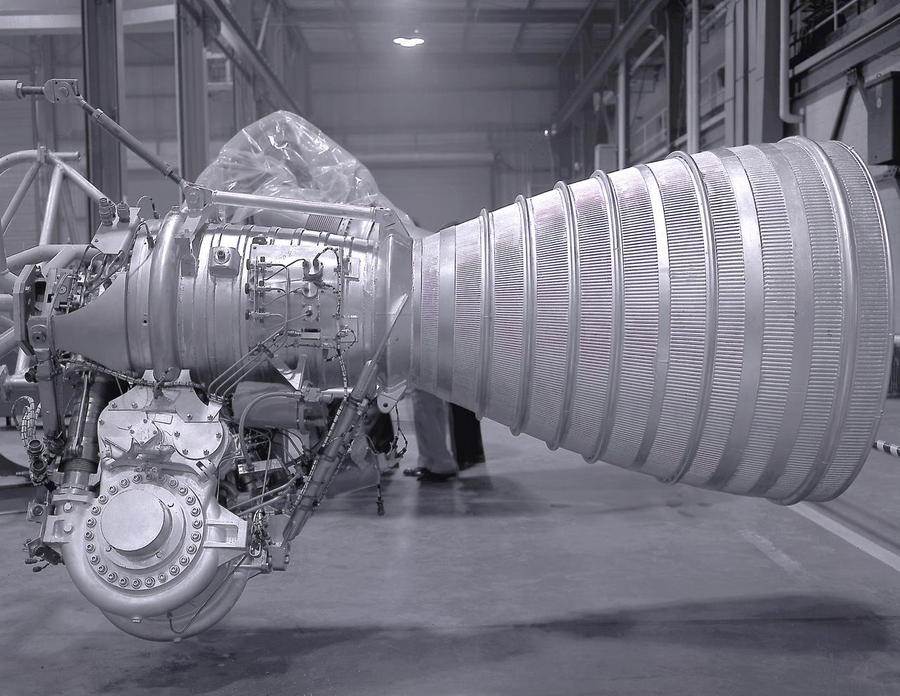 A Cluster of eight H-1 engines were used to thrust the first stage of Saturn I (S-I stage) and Saturn IB (S-IB stage). The engines were arranged in a double pattern. Four engines, located inboard, were fixed in a square pattern around the stage axis, while the remaining four engines were located outboard in a larger square pattern and each outer engine was gimbaled. Each H-1 engine, fueled with liquid oxygen (LOX) and kerosene (RP-1), had a thrust of 188,000 pound each for a combined thrust of over 1,500,000 pounds. The H-1 engine was developed under the direction of Marshall Space Flight Center (MSFC). 