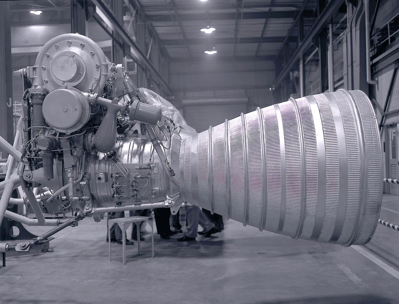 A Cluster of eight H-1 engines were used to thrust the first stage of Saturn I (S-I stage) and Saturn IB (S-IB stage). The engines were arranged in a double pattern. Four engines, located inboard, were fixed in a square pattern around the stage axis, while the remaining four engines were located outboard in a larger square pattern and each outer engine was gimbaled. The H-1 engine, fueled with liquid oxygen (LOX) and kerosene (RP-1), had a thrust of 188,000 pound each for a combined thrust of over 1,500,000 pounds. Each H-1 engine was developed under the direction of Marshall Space Flight Center (MSFC). 
