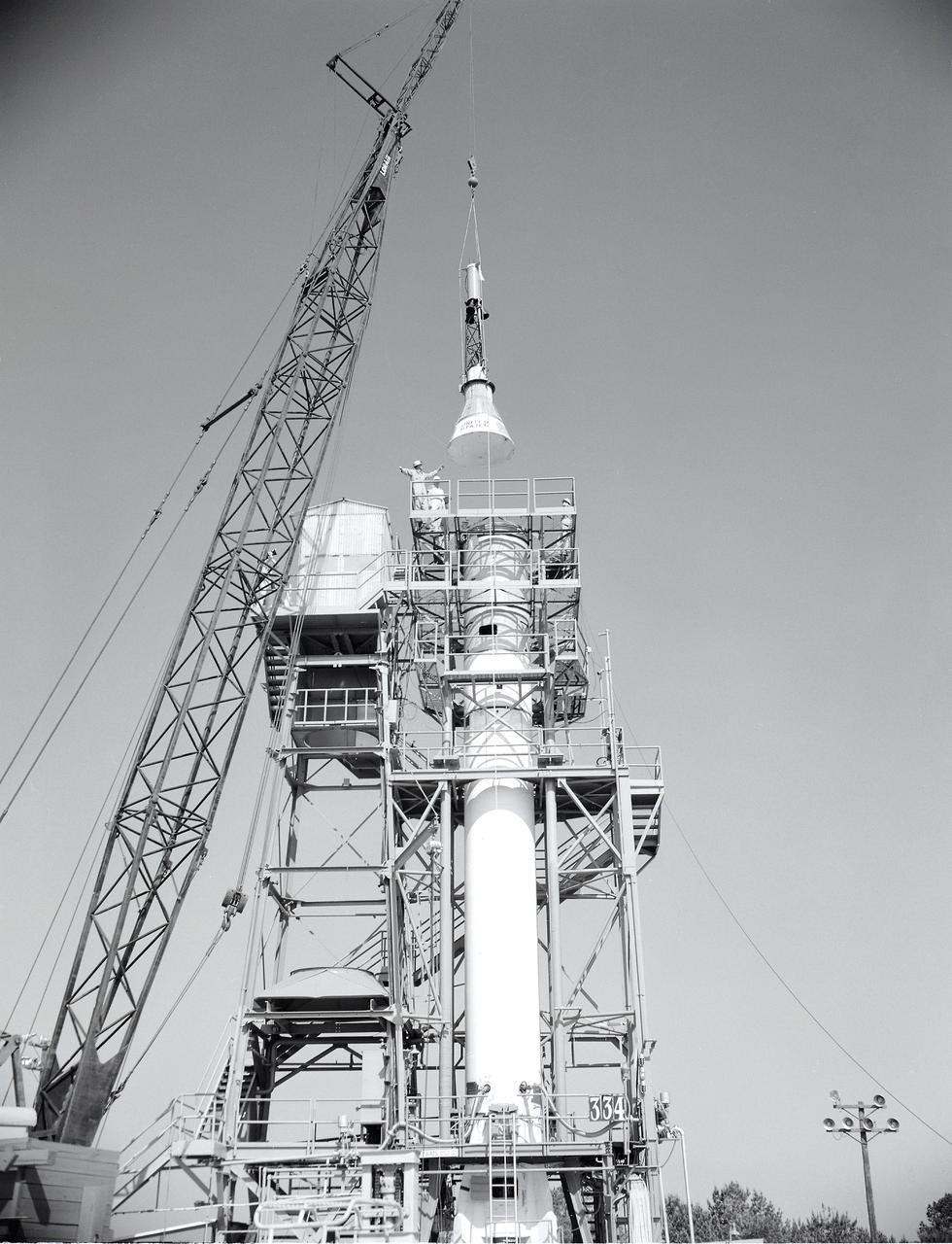 Installation of the Mercury capsule on Redstone booster at the Redstone Test Stand. Assembled at the Marshall Space Flight Center (MSFC), the Mercury-Redstone launch vehicle was designed to place a marned space capsule into orbital flight around the Earth and recover both safely. 