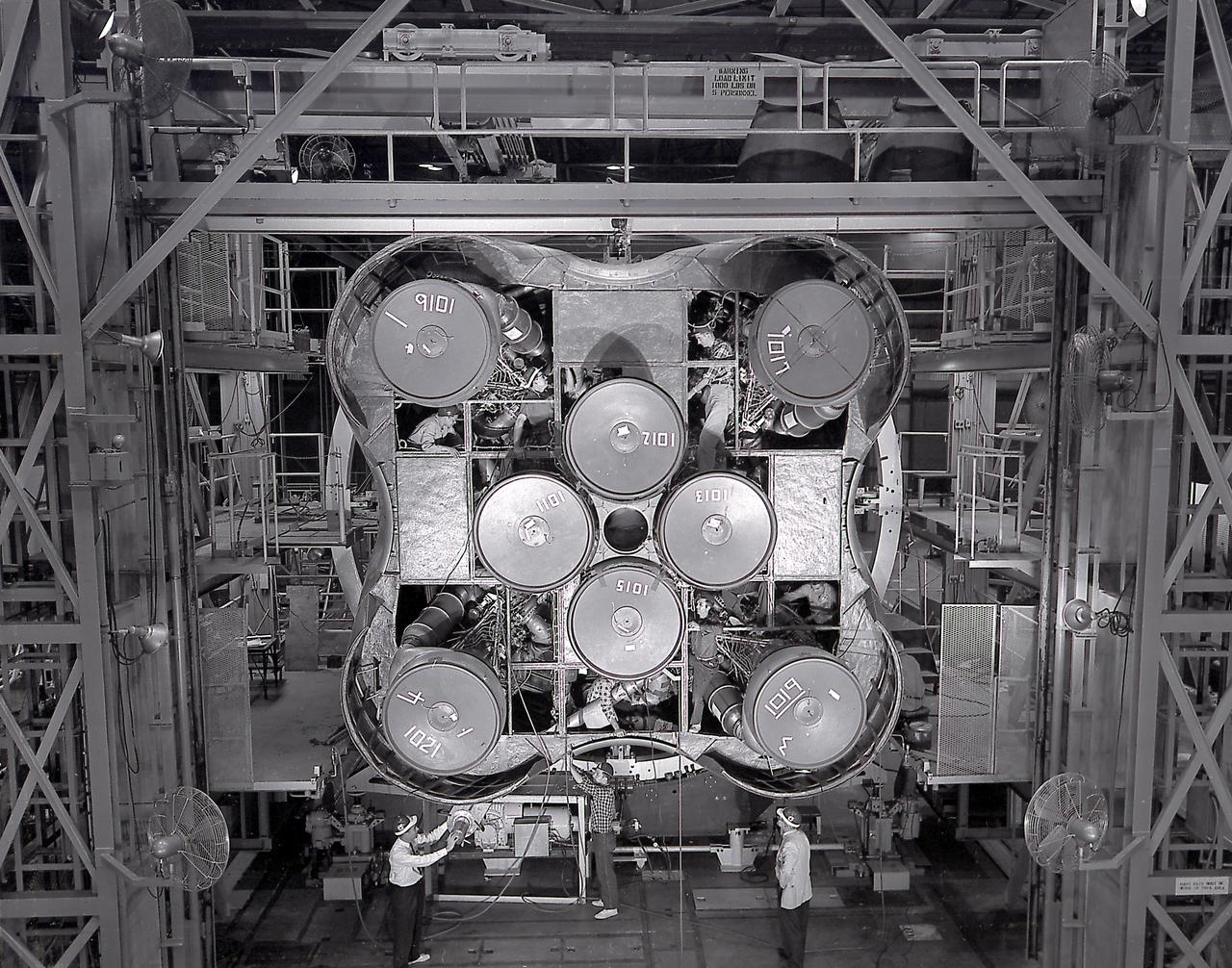The Saturn I S-I stage with eight H-1 engines, located in Marshall Space Flight Center building 4705, showing the positioning of eight H-1 engines. The Saturn I S-I stage had eight H-1 engines clustered, using liquid oxygen/kerosene-1 (LOX/RP-1) propellants capable of producing a total of 1,500,000 pounds of thrust. 