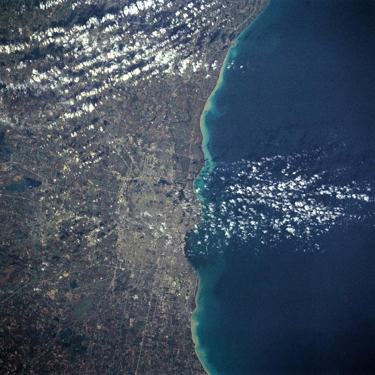 61A-31-005 (30 Oct 1985) --- This almost vertical view, photographed from Earth-orbit by an STS-61A crew member, centers on the metropolis of Milwaukee, Wisconsin, and some of the adjacent Lake Michigan shoreline, southward toward the Illinois border.  The 70mm frame was photographed on the first day of the Spacelab D-1 mission with a handheld Hasselblad camera.