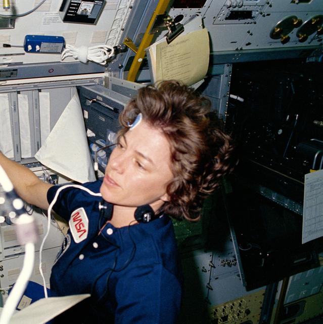 NASA image: Astronaut Bonnie Dunbar preparing to perform bio-medical test