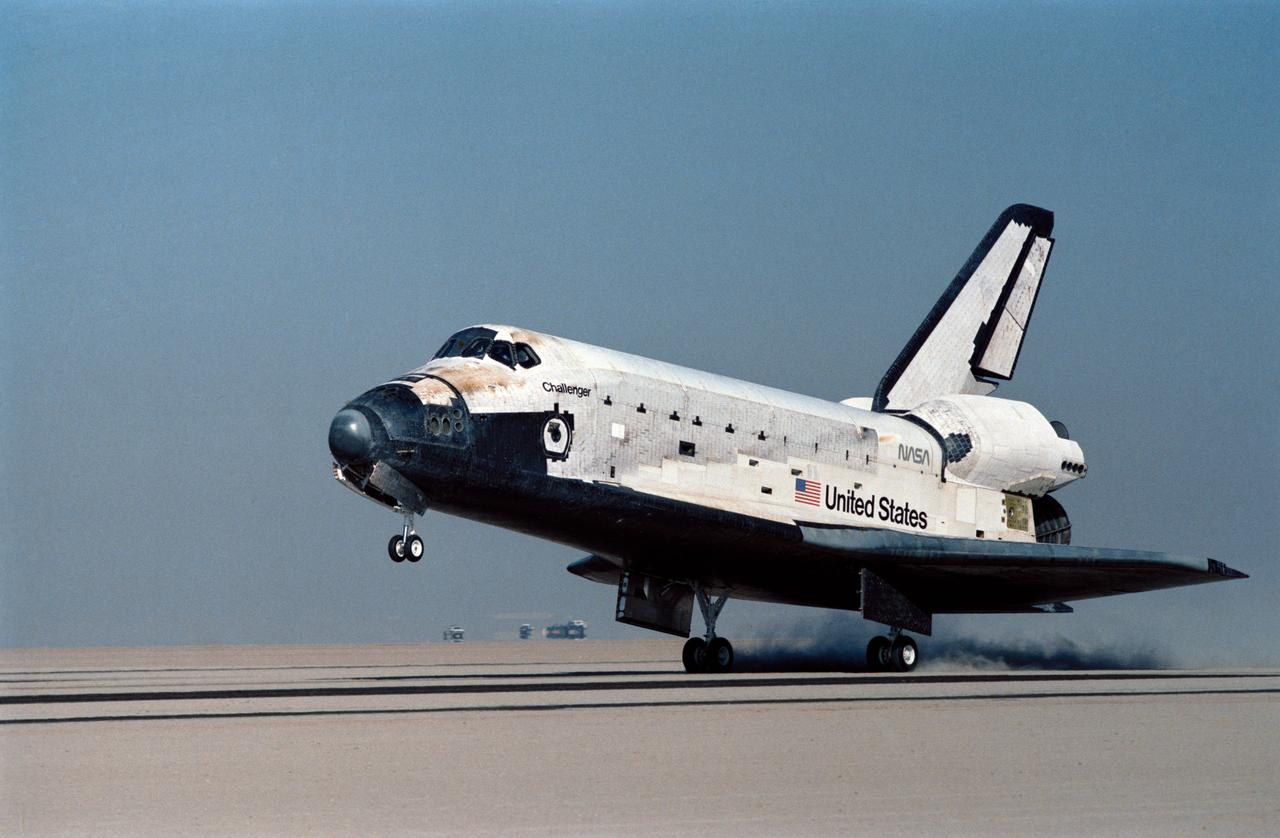 61A-S-139 (6 Nov 1985) --- Eight persons returning from space at one time is a record which was set at 9:45:39 a.m. (PST) today when the Space Shuttle Challenger's wheels came to a stop on the runway at Edwards Air Force Base.  The main gear is seen touching down at 9:44:51 a.m.  Inside the spacecraft are astronauts Henry W. Hartsfield Jr., Steven R. Nagel, Bonnie J. Dunbar, James F. Buchli, Guion S. Bluford Jr., Reinard Furrer, Ernst Messerschmid and Wubbo J. Ockels.  A number of West German and other European experiments were performed during the week-long Spacelab D-1 mission.