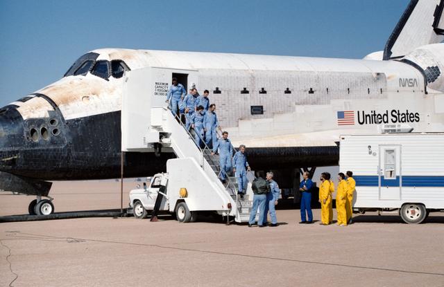 NASA image: The crew of the STS 61-A mission egress the Orbiter after landing