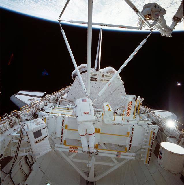 NASA image: Astronauts Jerry Ross and Sherwood Spring assemble ACCESS components