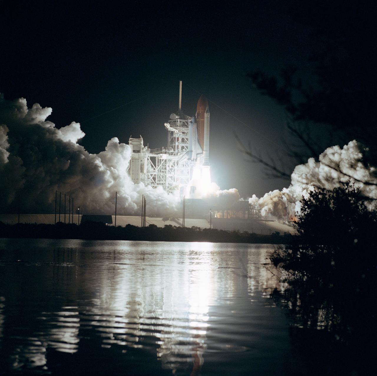 61B-S-067 (26 Nov 1985) --- Space Shuttle Atlantis ascends into the night sky at 7:29 p.m. (EST), November 26, with a seven member crew and three communications satellites aboard. The STS 61-B crewmembers are Brewster Shaw Jr., Bryan D. O?Connor, Mary L. Cleave, Sherwood C. Spring, Jerry L. Ross and Payload Specialists Rodolfo Neri of Mexico (Morelos) and Charles D. Walker of McDonnell Douglas.
