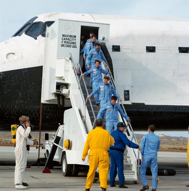 NASA image: STS 61-B crewmembers egress the Shuttle Atlantis after landing at Edwards