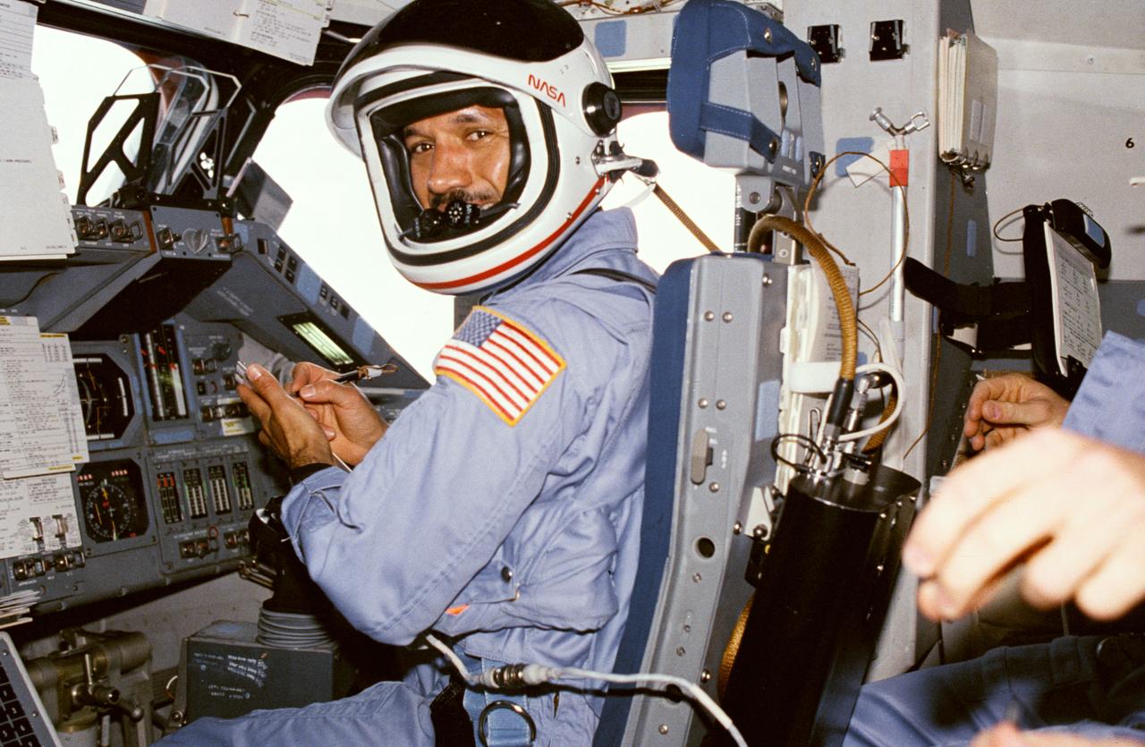61C-01-007 (12-17 Jan 1986)--- Astronaut Charles F. Bolden STS 61-C pilot, mans the pilot's station on Columbia's flight deck prior to re-entry.
