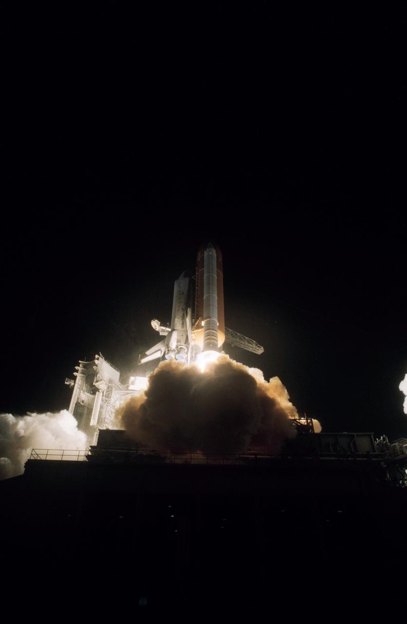 STS61C-S-047 (12 Jan. 1986) --- A remote camera records the early morning launch at Florida?s Kennedy Space Center of the space shuttle Columbia and the STS-61C crew on Jan. 12, 1986. Onboard were the following crew members -- Mission Commander Robert L. Gibson and Pilot Charles F. Bolden, along with Mission Specialists Franklin R. Chang-Diaz, Steven A. Hawley and George D. Nelson and Payload Specialists Robert J. Cenker of RCA and U.S. Rep. Bill Nelson. Photo credit: NASA