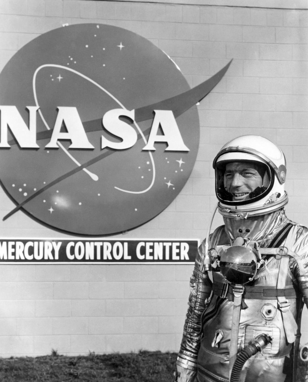 CAPE CANAVERAL, Fla. - Mercury astronaut Scott Carpenter stands in front of the Mercury Control Center. Carpenter flew the Aurora 7 mission, launched on May 24, 1962.     The Mercury Mission Control Center in Florida played a key role in the United States' early spaceflight program. Located at Cape Canaveral Air Force Station, the original part of the building was constructed between 1956 and 1958, with additions in 1959 and 1963. The facility officially was transferred to NASA on Dec. 26, 1963, and served as mission control during all the Project Mercury missions, as well as the first three flights of the Gemini Program, when it was renamed Mission Control Center. With its operational days behind, on June 1, 1967, the Mission Control Center became a stop on the public tour of NASA facilities until the mid-90s. In 1999, much of the equipment and furnishings from the Flight Control Area were moved to the Kennedy Space Center Visitor Complex where they became part of the exhibit there. The building was demolished in spring 2010. Photo credit: NASA