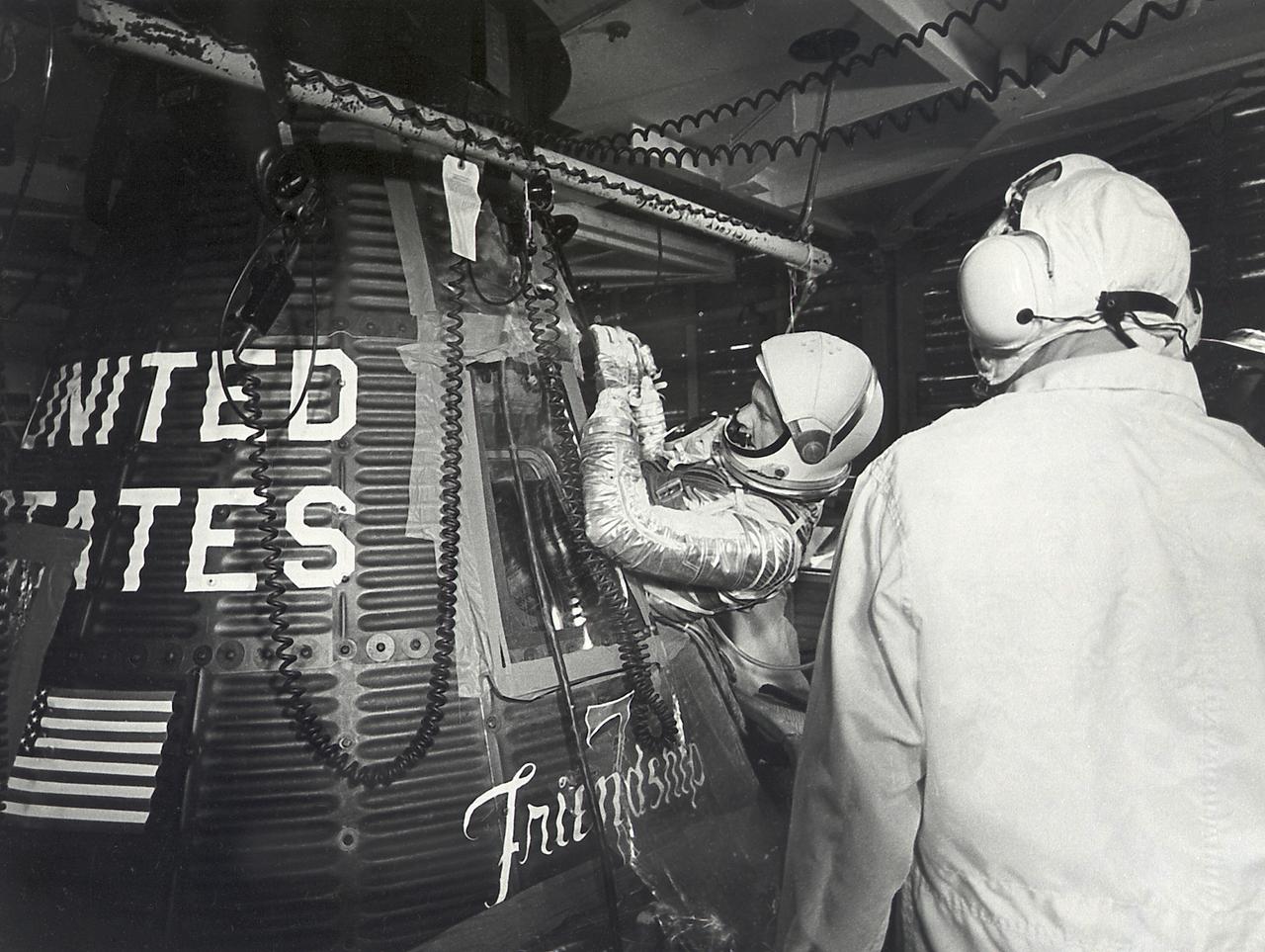 Astronaut John Glenn enters the Mercury spacecraft, Friendship 7, prior to the launch of MA-6 on February 20, 1961 and became the first American who orbited the Earth. The MA-6 mission was the first manned orbital flight boosted by the Mercury-Atlas vehicle, a modified Atlas ICBM (Intercontinental Ballistic Missile), lasted for five hours, and orbited the Earth three times. 