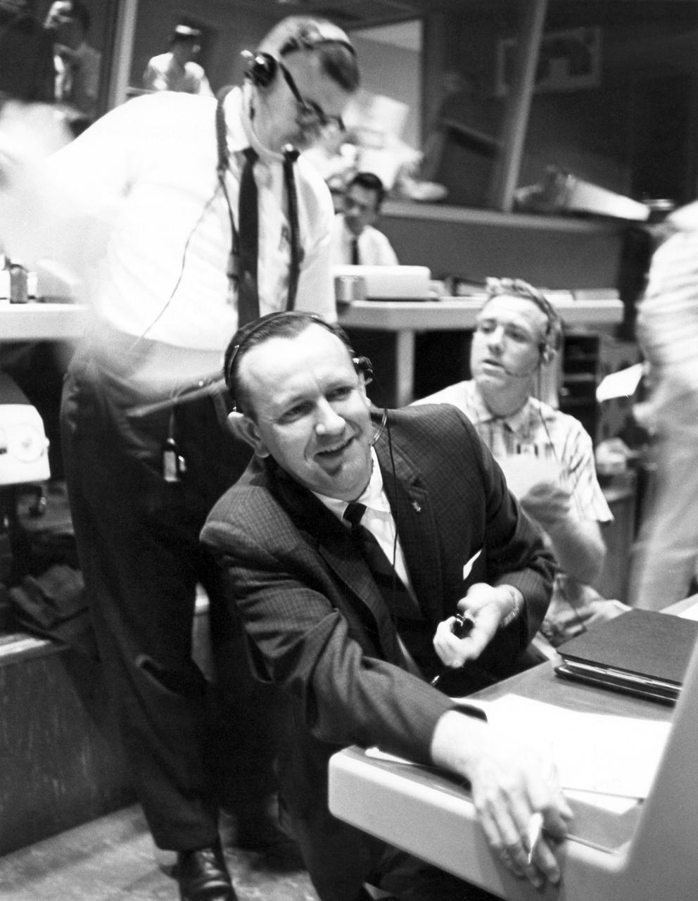 CAPE CANAVERAL, Fla. - Inside Mercury Mission Control, Christopher Kraft, Mercury's flight director, sits at his console during preparations for astronaut Gordon Cooper's Faith 7 launch, which took place on May 15, 1963.     The Mercury Mission Control Center in Florida played a key role in the United States' early spaceflight program. Located at Cape Canaveral Air Force Station, the original part of the building was constructed between 1956 and 1958, with additions in 1959 and 1963. The facility officially was transferred to NASA on Dec. 26, 1963, and served as mission control during all the Project Mercury missions, as well as the first three flights of the Gemini Program, when it was renamed Mission Control Center. With its operational days behind, on June 1, 1967, the Mission Control Center became a stop on the public tour of NASA facilities until the mid-90s. In 1999, much of the equipment and furnishings from the Flight Control Area were moved to the Kennedy Space Center Visitor Complex where they became part of the exhibit there. The building was demolished in spring 2010. Photo credit: NASA