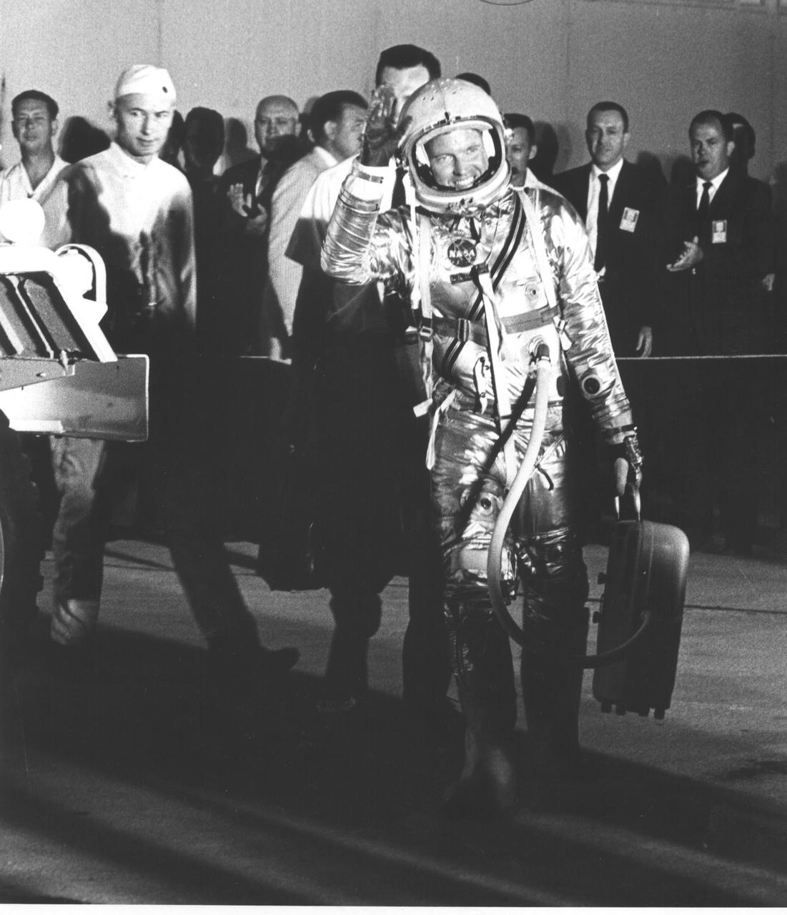 CAPE CANAVERAL, FLA. -- Hangar 'S' -- Mercury workers and news media are greeted by astronaut L. Gordon Cooper as he leaves Hangar 'S' for Pad 14 to start his 22-orbit mission, MA-9.