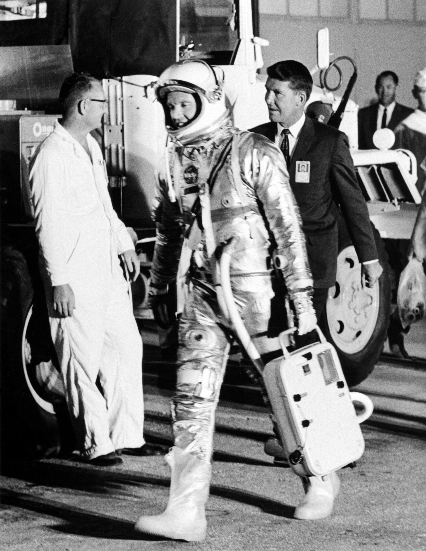 Gordon Cooper walks with his space suit on for his Faith 7 flight