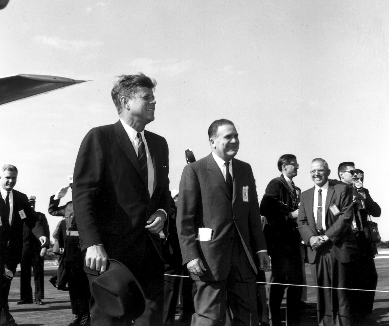KENNEDY SPACE CENTER, FLA. -- President John F. Kennedy, accompanied by NASA Administrator James T. Webb, arrive at the Skid Strip, CCMTA, for a tour of the Launch Operations Center.