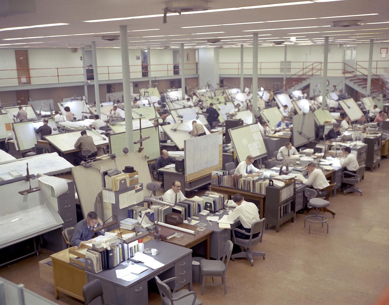 Temporary quarters in the Huntsville Industrial Center (HIC) building located in downtown Huntsville, Alabama, as Marshall Space Flight Center (MSFC) grew. This image shows drafting specialists from the Propulsion and Vehicle Engineering Laboratory at work in the HIC building.