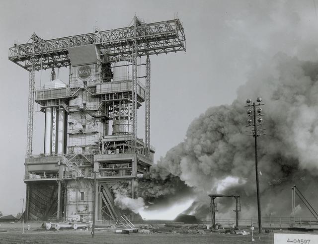 The flame and exhaust from the test firing of an F-1 engine blast out from the Saturn S-IB Static Test Stand in the east test area of the Marshall Space Flight Center. A Cluster of five F-1 engines, located in the S-IC (first) stage of the Saturn V vehicle, provided over 7,500,000 pounds of thrust to launch the giant rocket. The towering 363-foot Saturn V was a multistage, multiengine launch vehicle standing taller than the Statue of Liberty. Altogether, the Saturn V engines produced as much power as 85 Hoover Dams.