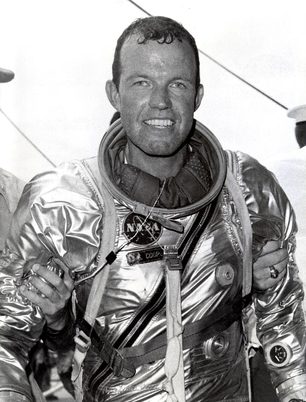 Astronaut Gordon Cooper leaves the Faith 7 (MA-9) spacecraft after a successful recovery operation. The MA-9 mission, the last flight of the Mercury Project, was launched on May 15, 1963, orbited the Earth 22 times, and lasted for 1-1/2 days.