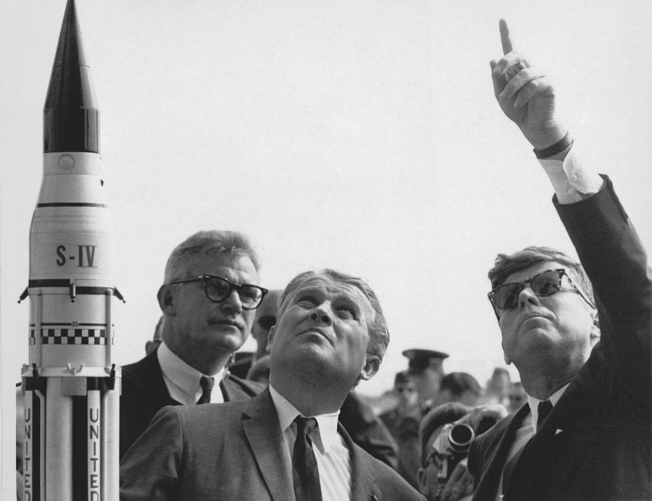 KENNEDY SPACE CENTER, FLA. -- Dr. Werner Von Braun explains the Saturn system to President John F. Kennedy at Complex 37 who was on tour at the Cape Canaveral Missile Test Annex (CCMTA).