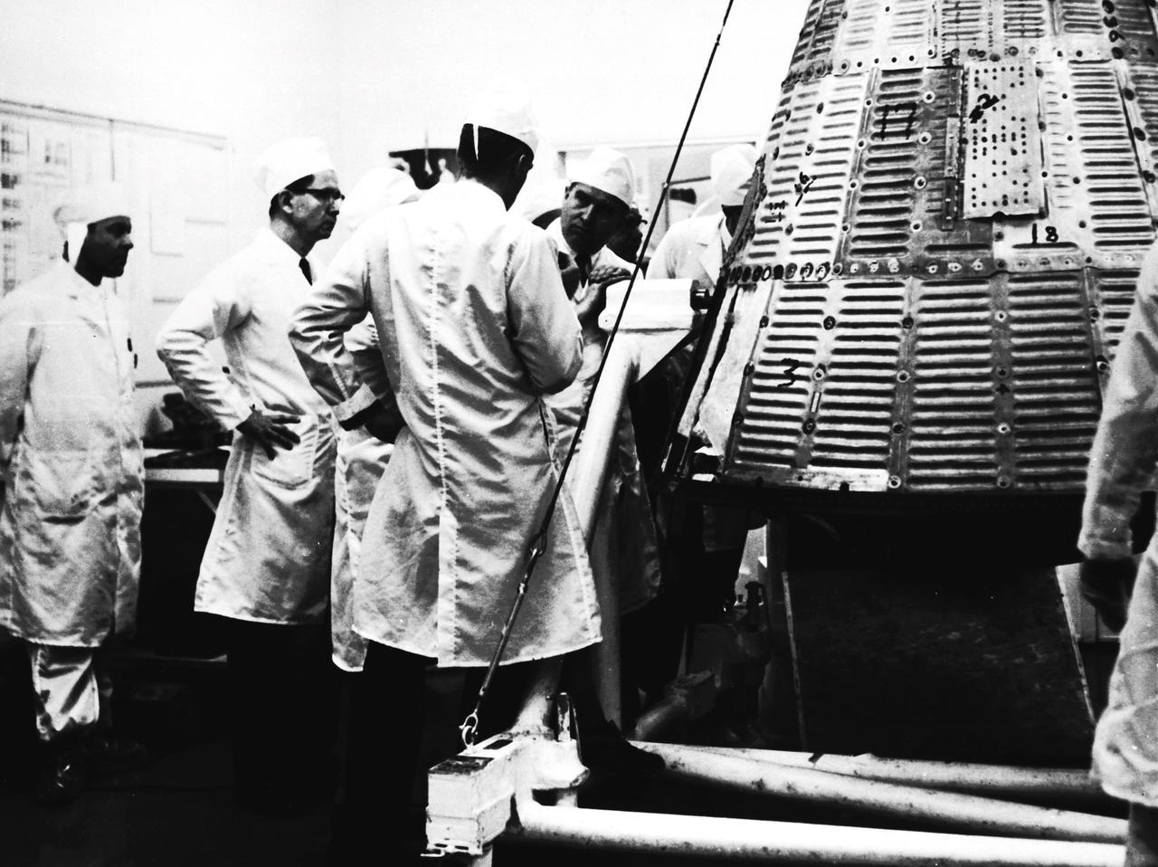 In this undated photograph, Dr. von Braun is shown during a visit to McDonnell Aircraft to inspect Mercury spacecraft manufacturing.