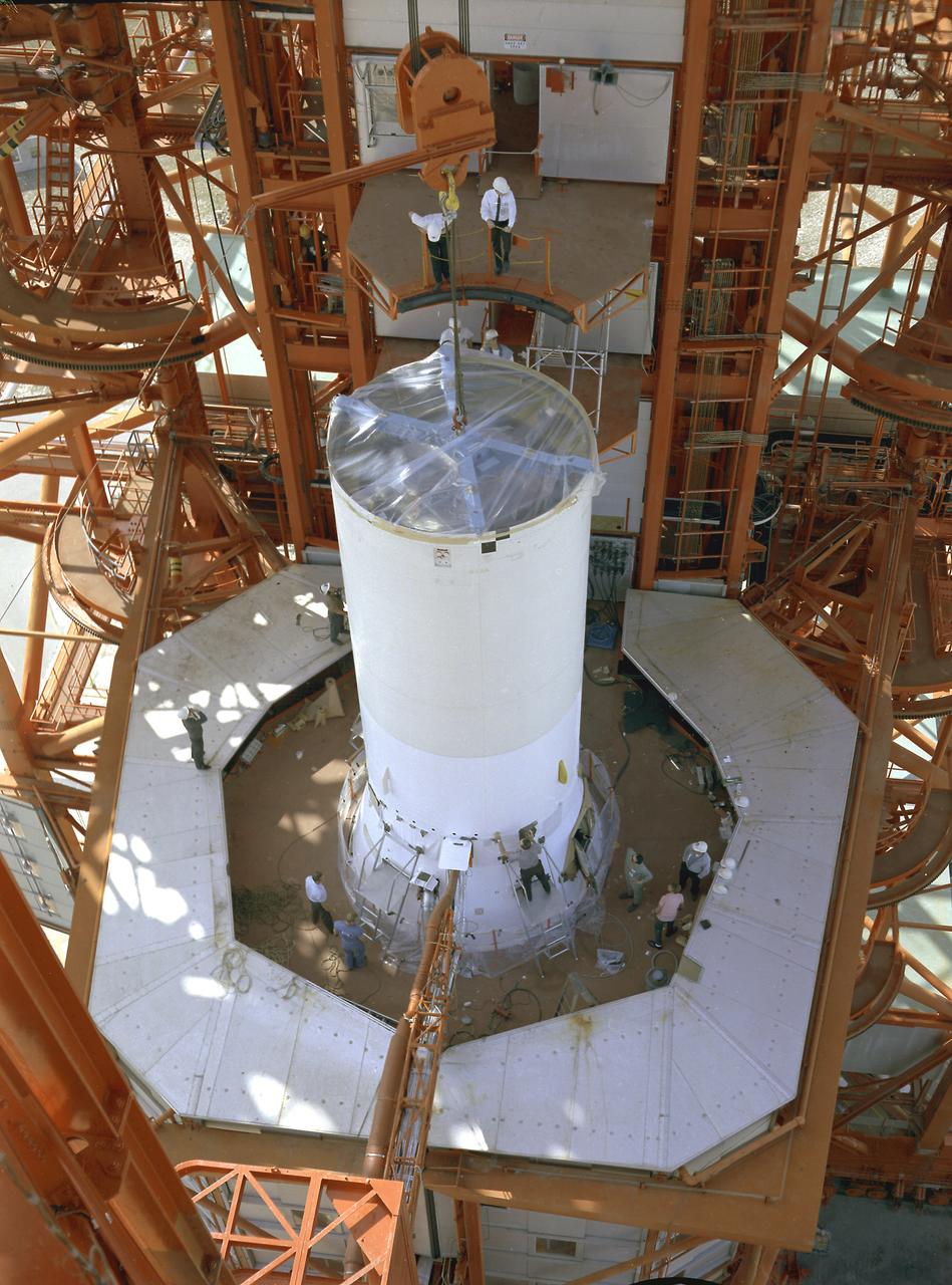 Pegasus-1, meteoroid detection satellite, installed on Saturn I (SA-9 mission) S-IV stage, January 13, 1965. The satellite was used to obtain data on frequency and penetration of the potentially hazardous micrometeoroids in low Earth orbits and to relay the information back to Earth. SA-9 was launched on February 16, 1965 and the Pegasus-1 satellite was the first operational payload for Saturn I.