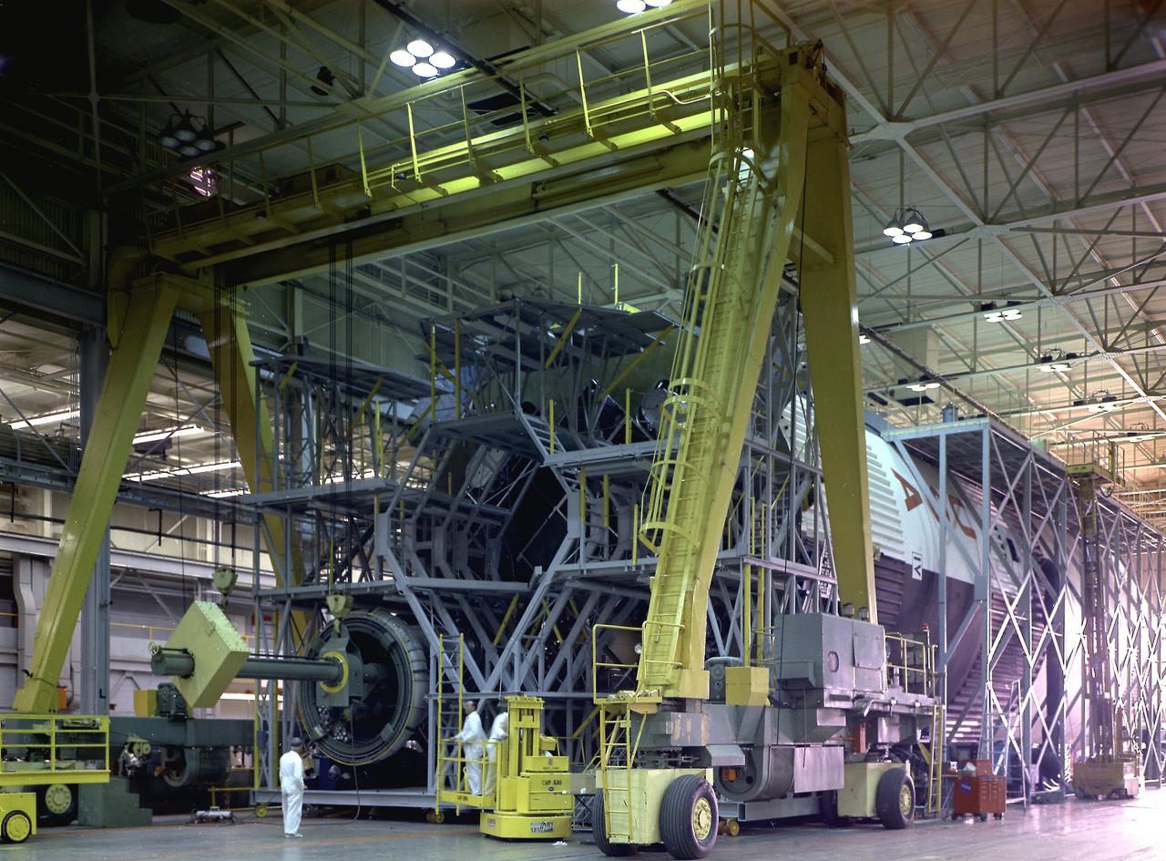 Engineers and technicians at the Marshall Space Flight Center were installing an F-I engine on the Saturn V S-IC (first) stage thrust structure in building 4705. The S-IC (first) stage used five F-1 engines that produced a total thrust of 7,500,000 pounds as each engine produced 1,500,000 pounds of thrust. The S-IC stage lifted the Saturn V vehicle and Apollo spacecraft from the launch pad.