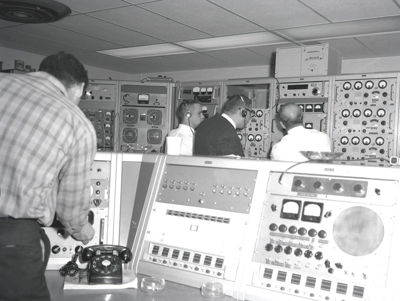 Activities at Green Mountain Tracking Station, Alabama, during lift-off of the Saturn I, SA-9 mission, showing the overall view of instrument panels used in tracking the Pegasus, meteoroid-detection satellite. The satellite was used to obtain data on frequency and penetration of the potentially hazardous micrometeoroids in low Earth orbits and to relay the information back to Earth.
