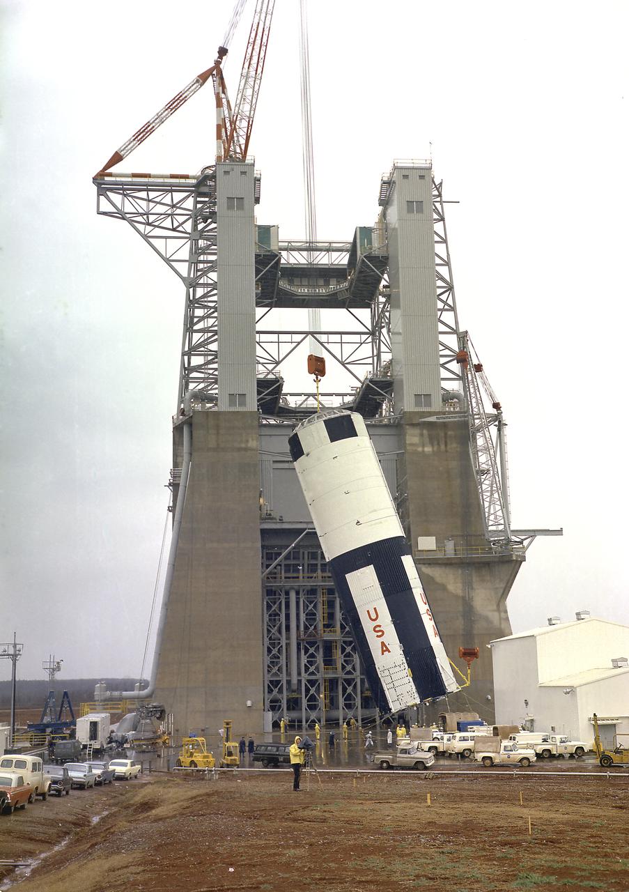 The S-IC-T stage was hoisted into the S-IC static test stand at the Marshall Space Flight Center. The S-IC-T stage was a static test vehicle not intended for flight. It was ground tested repeatedly over a period of many months to prove the vehicle's propulsion system. The 280,000-pound stage, 138 feet long and 33 feet in diameter, housed the fuel and liquid oxygen tanks that held a total of 4,400,000 pounds of liquid oxygen and kerosene. The two tanks are cornected by a 26-foot-long intertank section. Other parts of the booster included the forward skirt and the thrust structure, on which the engines were to be mounted. Five F-1 engines, each weighing 10 tons, gave the booster a total thrust of 7,500,000 pounds, roughly equivalent to 160 million horsepower.