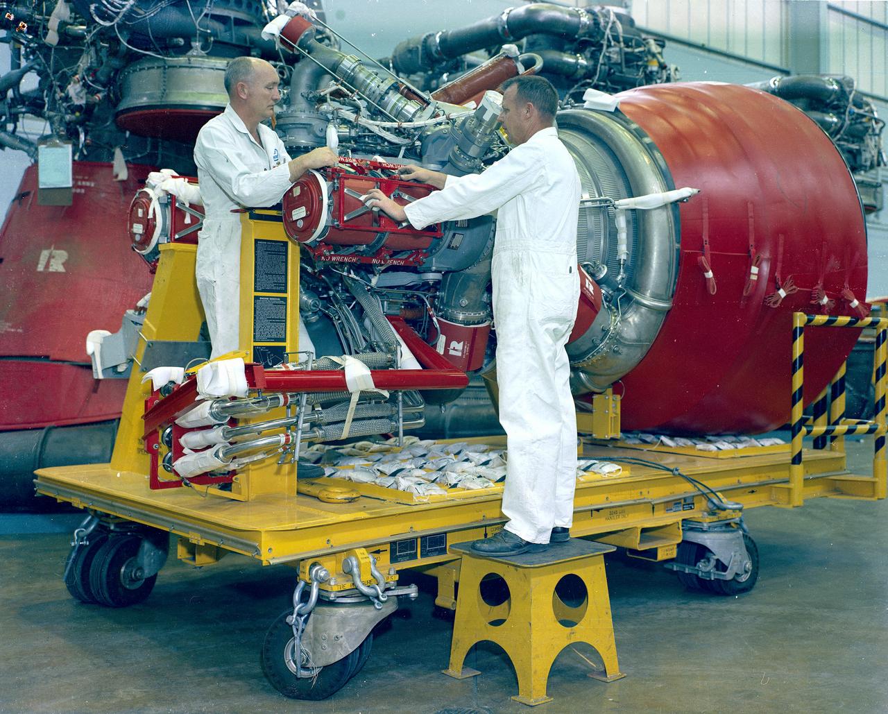 Pictured is a J-2 engine being processed at Marshall Space Flight Center (MSFC). A single J-2 engine was utilized on the S-IVB stage, the second stage of the Saturn IB and the third stage of the Saturn V vehicles, while a cluster of five J-2 engines powered the second (S-II) stage of the Saturn V launch vehicle. The Saturn V was designed, developed, and tested by engineers at MSFC.