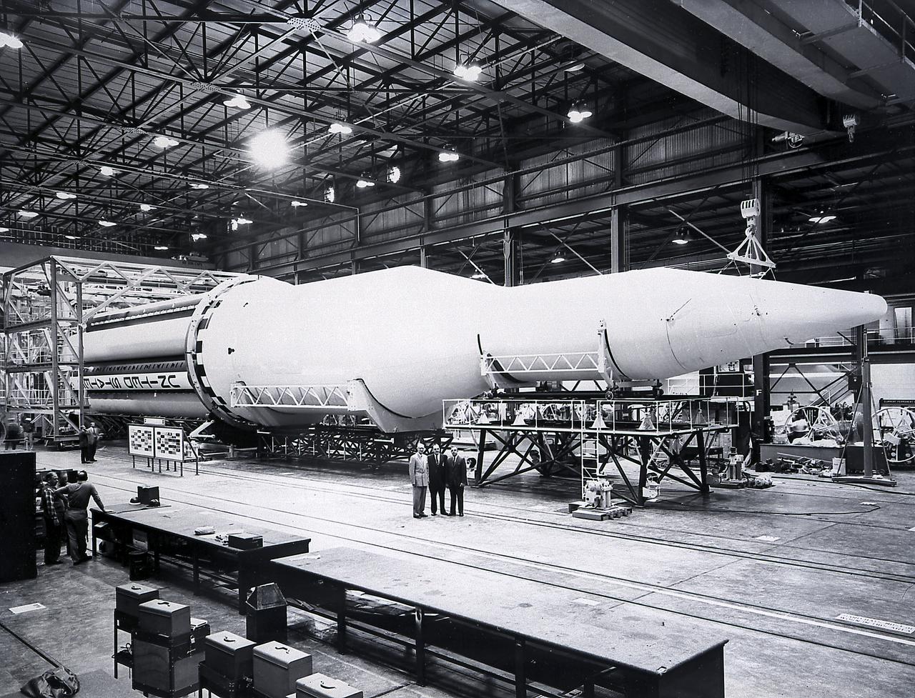 A completed Saturn I launch vehicle in the Fabrication and Assembly Engineering Division at the Marshall Space Flight Center. The Saturn I launch vehicle is composed of an S-I first stage or booster (rear), powered by eight H-1 engines having a thrust of 1,500,000 pounds, followed by a dummy S-IV second stage with six RL-10 engine, with a total thrust of 90,000 pounds.