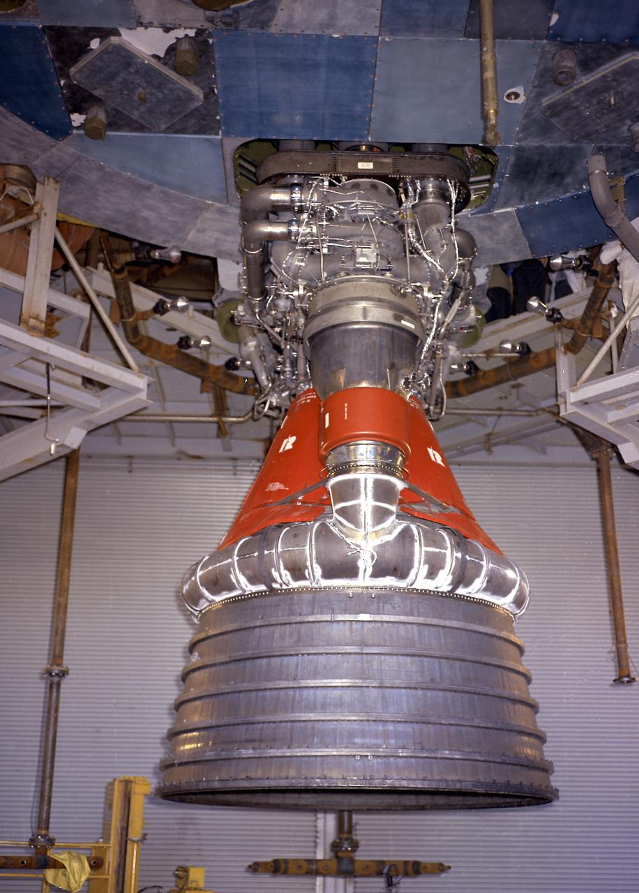 Engineers at the Marshall Space Flight Center install the F-1 engines on the S-IC stage thrust structure at the S-IC static test stand. Engines are installed on the stage after it has been placed in the test stand. This image shows a close-up of an F-1 engine. Five F-1 engines, each weighing 10 tons, gave the booster a total thrust of 7,500,000 pounds, roughly equivalent to 160 million horsepower. 