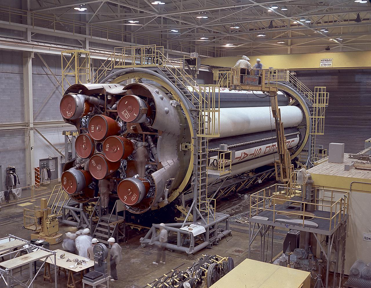 The photograph shows the completed Saturn 1 S-1 stage (booster) during the checkout in the Marshall Space Flight Center, building 4705, January 23, 1961. The Saturn I S-I stage had eight H-1 engines clustered, using liquid oxygen/kerosene-1 (LOX/RP-1) propellants capable of producing a total of 1,500,000 pounds of thrust. 