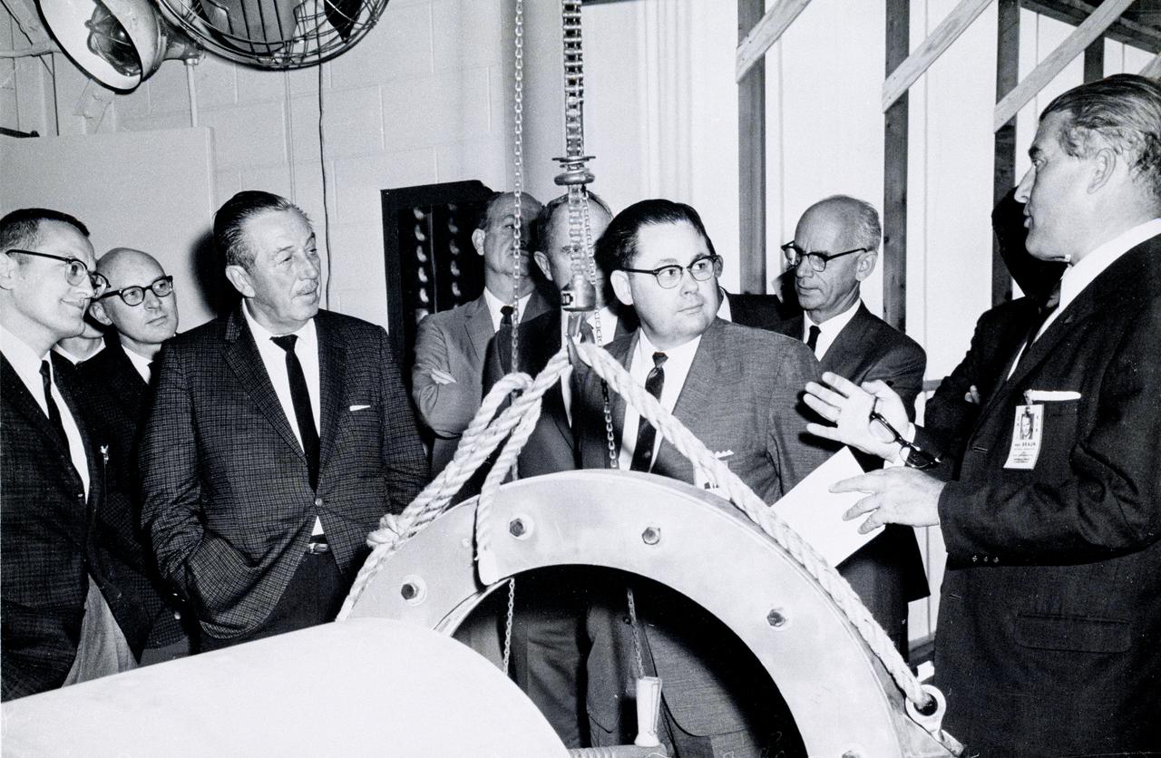 Dr. von Braun began his association with Walt Disney in the 1950s when the rocket scientist appeared in three Disney television productions related to the exploration of space. Years later, Dr. von Braun invited Disney and his associates to tour the Marshall Space Flight Center (MSFC) in Huntsville, Alabama. This photograph is dated April 13, 1965. From left are R.J. Schwinghamer from the MSFC, Disney, B.J. Bennight, and Dr. von Braun.