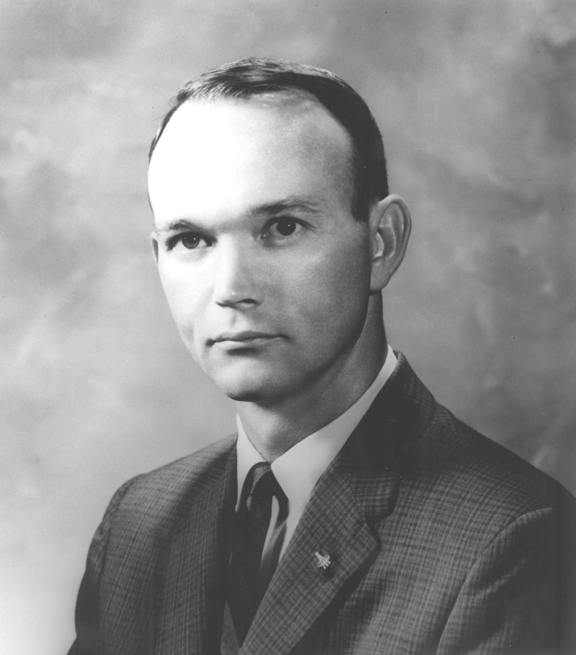This is the official NASA portrait of astronaut Michael Collins. Collins chose an Air Force career following graduation from West Point. He served as an experimental flight test officer at the Air Force Flight Test Center, Edwards Air Force Base, California, and, in that capacity, tested performance and stability and control characteristics of Air Force aircraft, primarily jet fighters. Having logged approximately 5,000 hours flying time, Collins was one of the third group of astronauts named by NASA in October 1963. Collins completed two space flights, logging 266 hours in space, of which, 1 hour and 27 minutes was spent in Extra Vehicular Activity (EVA). On July 18, 1966, he served as backup pilot for the Gemini VII mission which included a successful rendezvous and docking with a separately launched Agena target vehicle and, using the power of the Agena, maneuvered the Gemini spacecraft into another orbit for a rendezvous with a second, passive Agena. His skillful performance in completing two periods of EVA included the recovery of a micrometeorite detection experiment from the passive Agena. July 16-24, 1969, Collins served as command module (CM) pilot on Apollo 11, the historic first lunar landing mission. He remained aboard the CM, Columbia, on station in lunar orbit and performed the final re-docking maneuvers following a successful lunar orbit rendezvous with the Lunar Module (LM), Eagle. Collins left NASA in January 1970.