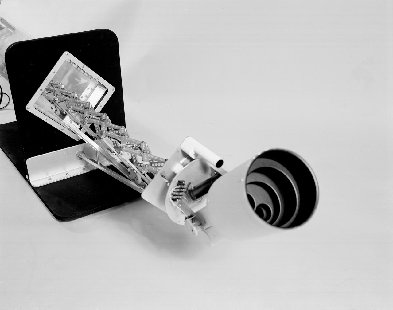 The Apollo Telescope Mount (ATM), designed and developed by the Marshall Space Flight Center, served as the primary scientific instrument unit aboard the Skylab. The ATM contained eight complex astronomical instruments designed to observe the Sun over a wide spectrum from visible light to x-rays. This photo of the ATM contamination monitor mockup offers an extended view of the sunshield interior.