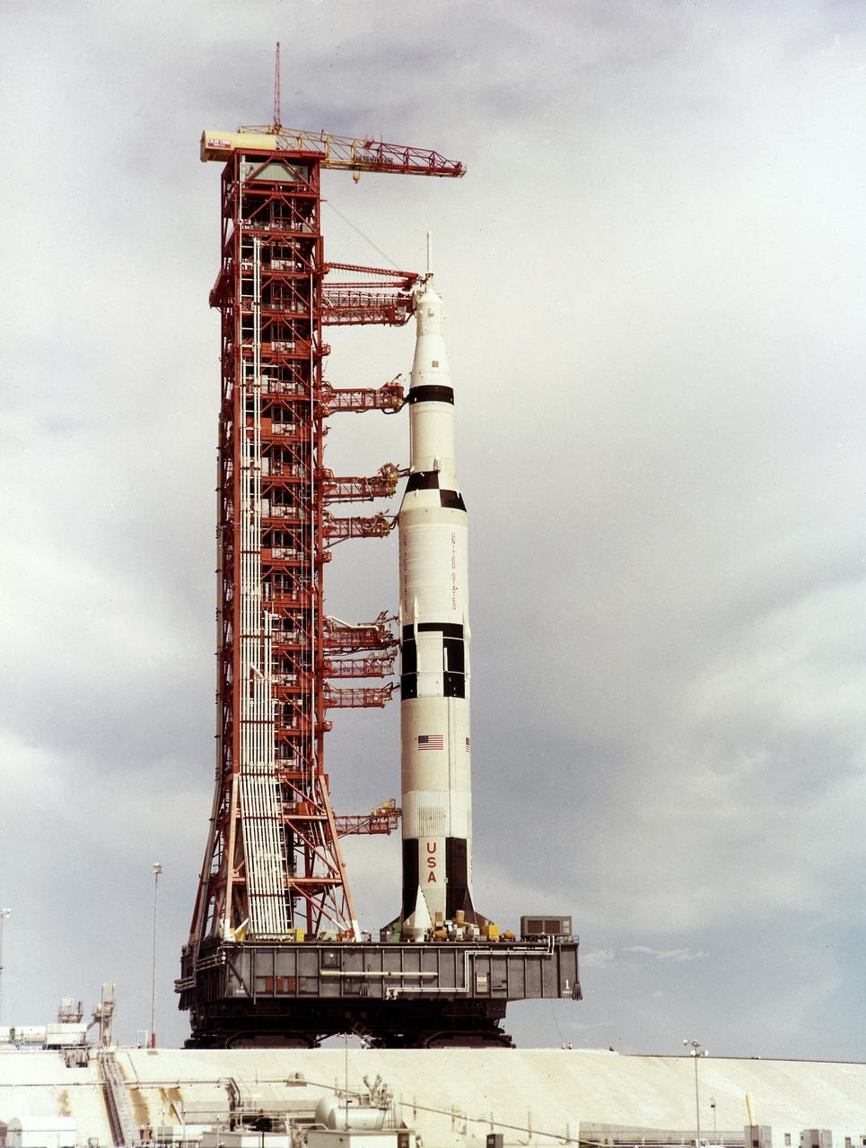 This is a view of the the first test flight of the Saturn V vehicle (SA-501) at the Kennedy Space Center (KSC) launch complex 39A, awaiting the scheduled launch on November 9, 1967. Designated as Apollo 4, this mission was the first launch of the Saturn V launch vehicle. Objectives of the unmanned Apollo 4 test flight were to obtain flight information on launch vehicle and spacecraft structural integrity and compatibility, flight loads, stage separation, and subsystems operation including testing of restart of the S-IVB stage, and to evaluate the Apollo command module heat shield. 