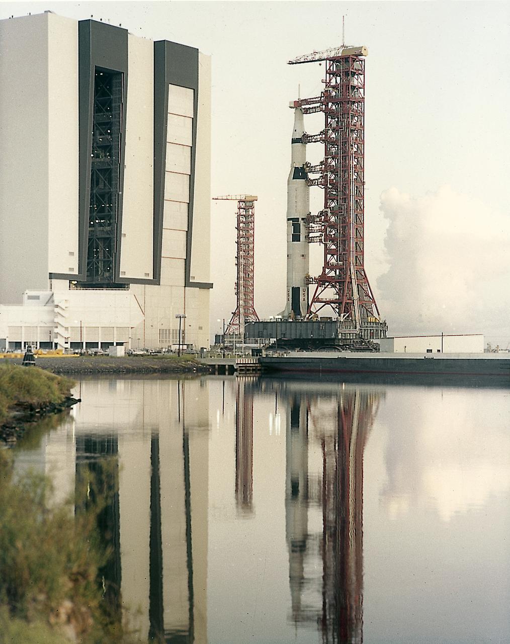 This picture shows the Saturn V vehicle (AS-501), for the Apollo 4 mission on the Crawler Transporter Vehicle. It was rolled out from the Vehicle Assembly Building and slowly (1 mph) moved to the launch pad at the Kennedy Space Center (KSC). The Apollo 4 mission was the first launch of the Saturn V launch vehicle. Objectives of the unmanned Apollo 4 test flight were to obtain flight information on launch vehicle and spacecraft structural integrity and compatibility, flight loads, stage separation, and subsystems operation including testing of restart of the S-IVB stage, and to evaluate the Apollo command module heat shield. The Apollo 4 was launched on November 9, 1967 from KSC. 