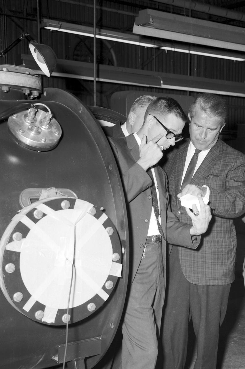 Dr. von Braun and party look at a laser beam component during a visit at the Marshall Space Flight Center Space Science Laboratory on August 28, 1967.