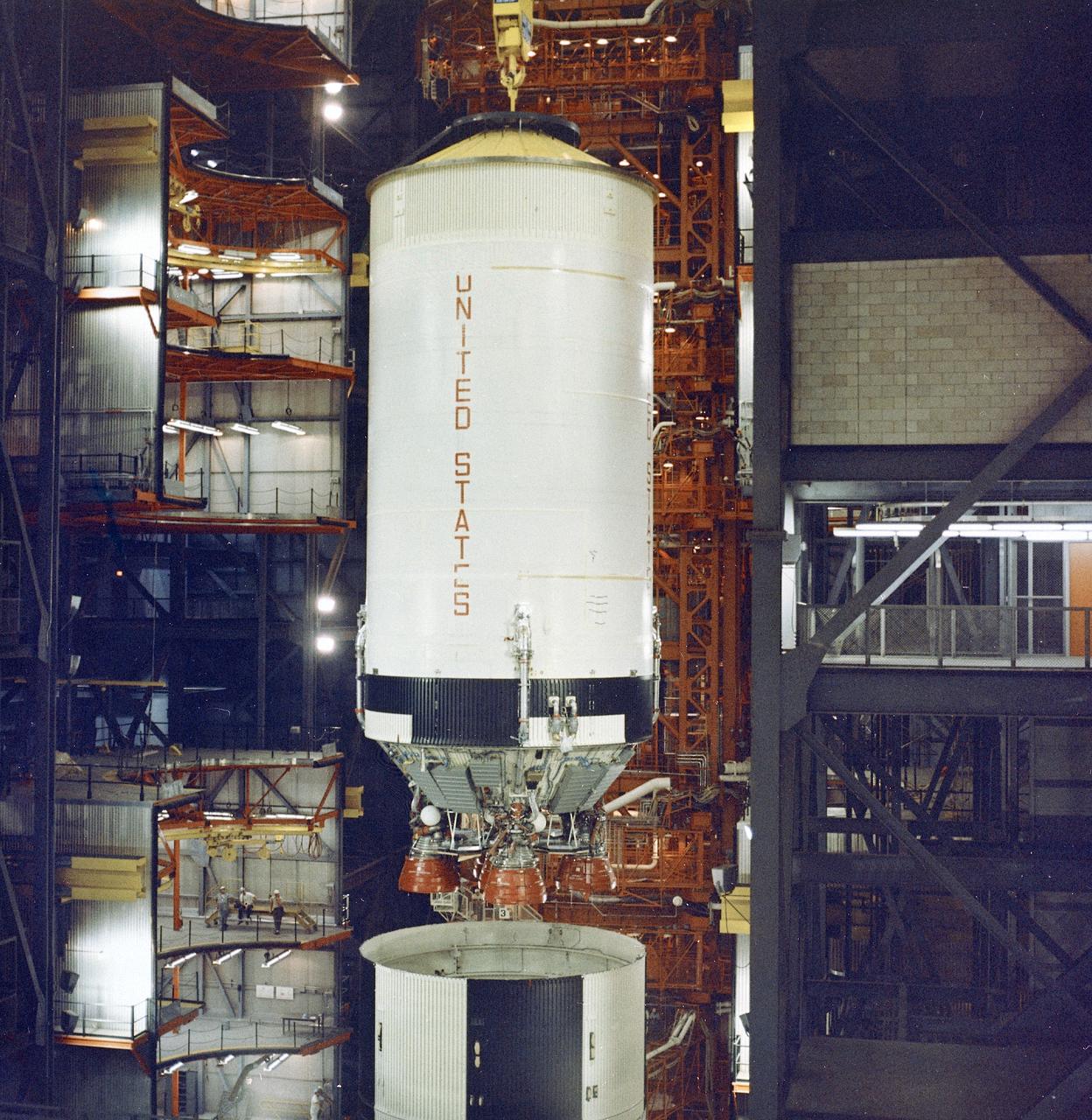 This photograph shows the Saturn V S-II (second) stage of the Apollo 6 mission being lowered atop of the S-IC (first) stage during the final assembly operations in the Vehicle Assembly Building (VAB) at the Kennedy Space Center. The Apollo 6 mission was the second Saturn V unmanned flight for testing an emergency detection system. The launch occurred on April 4, 1968.