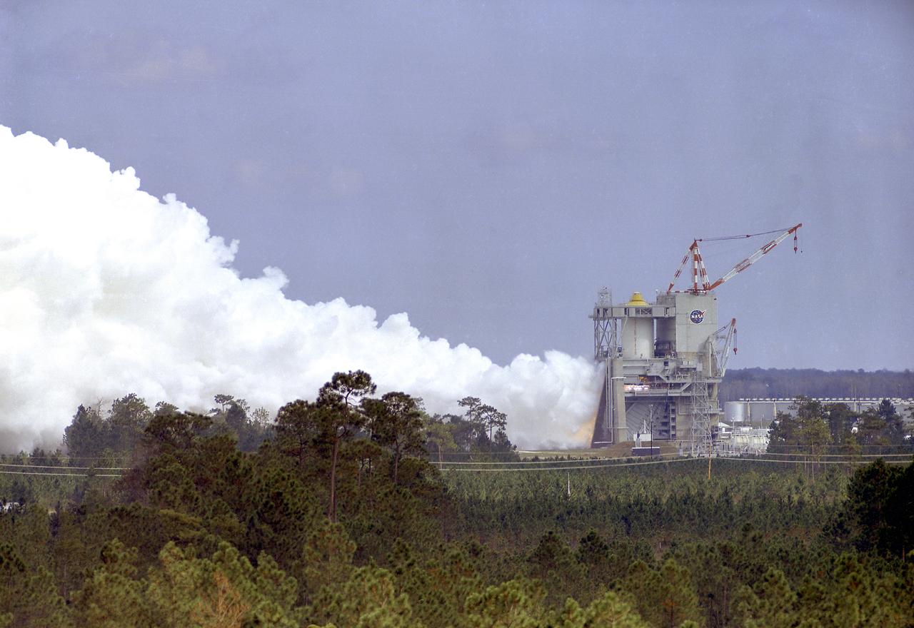 This photograph shows a test firing of the the Saturn V S-II (second) stage at the Mississippi Test Facility's (MTF) S-II test stand. When the Saturn V booster stage (S-IC) burns out and drops away, power for the Saturn will be provided by the 82-foot-long and 33-foot-diameter S-II stage. Developed by the Space Division of North American Aviation under the direction of the Marshall Space Flight Center, the stage utilized five J-2 engines, each producing 200,000 pounds of thrust. The engine used liquid oxygen and liquid hydrogen as its propellants. Static test of ground test versions of the S-II stage were conducted at North American Aviation's Santa Susana, California test site. All flight stages were tested at the Mississippi Test Facility, Bay St. Louis, Mississippi. The MTF was renamed to the National Space Technology Laboratory (NSTL) in 1974 and later to the Sternis Space Center (SSC) in May 1988. 