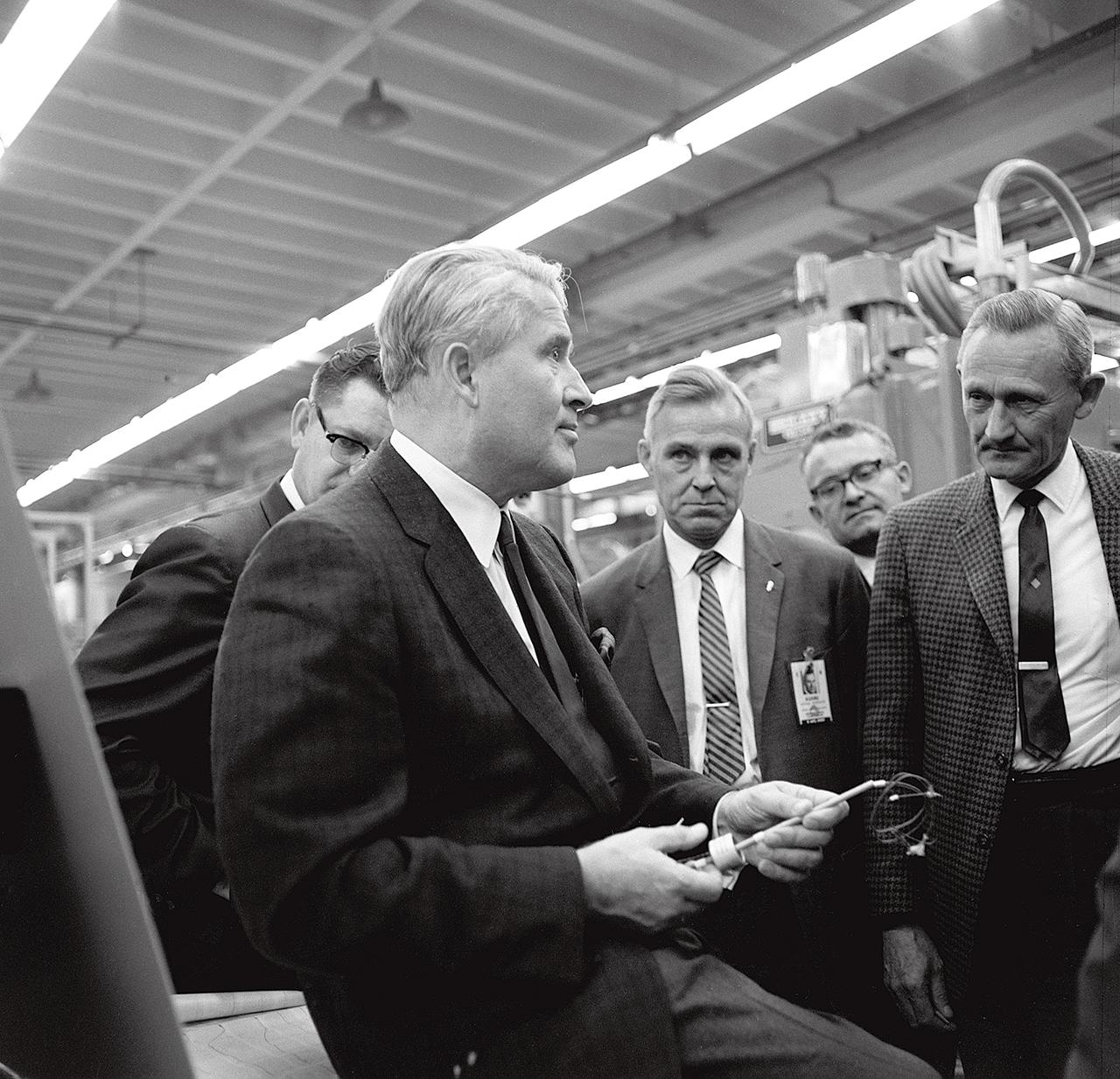 Dr. von Braun encouraged his laboratory directors and other managers at the Marshall Space Flight Center (MSFC) to adopt a "hands-on" approach to managing the technical challenges they confronted in developing the Saturn rockets for the Marned Lunar Landing Program. He is shown here asking a question about welding in an MSFC manufacturing and engineering laboratory. This photograph was made on or about October 17, 1967.
