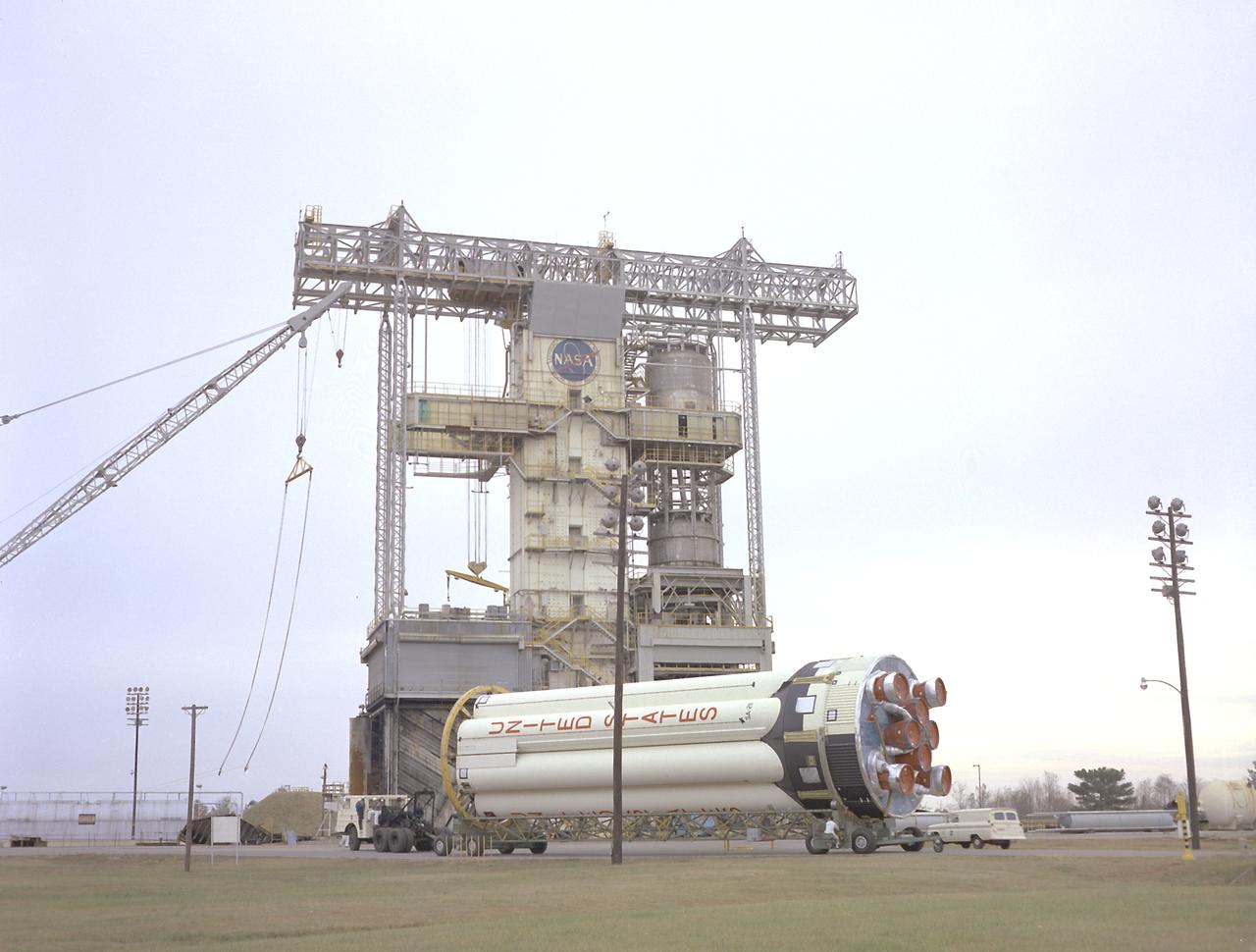 S-IB-211, the flight version of the Saturn IB launch vehicle's first (S-IVB) stage, arrives at Marshall Space Flight Center's (MSFC's) S-IB static test stand. Between December 1967 and April 1968, the stage would undergo seven static test firings. The S-IB, developed by the MSFC and built by the Chrysler Corporation at the Michoud Assembly Facility near New Orleans, Louisiana, utilized eight H-1 engines and each produced 200,000 pounds of thrust. 