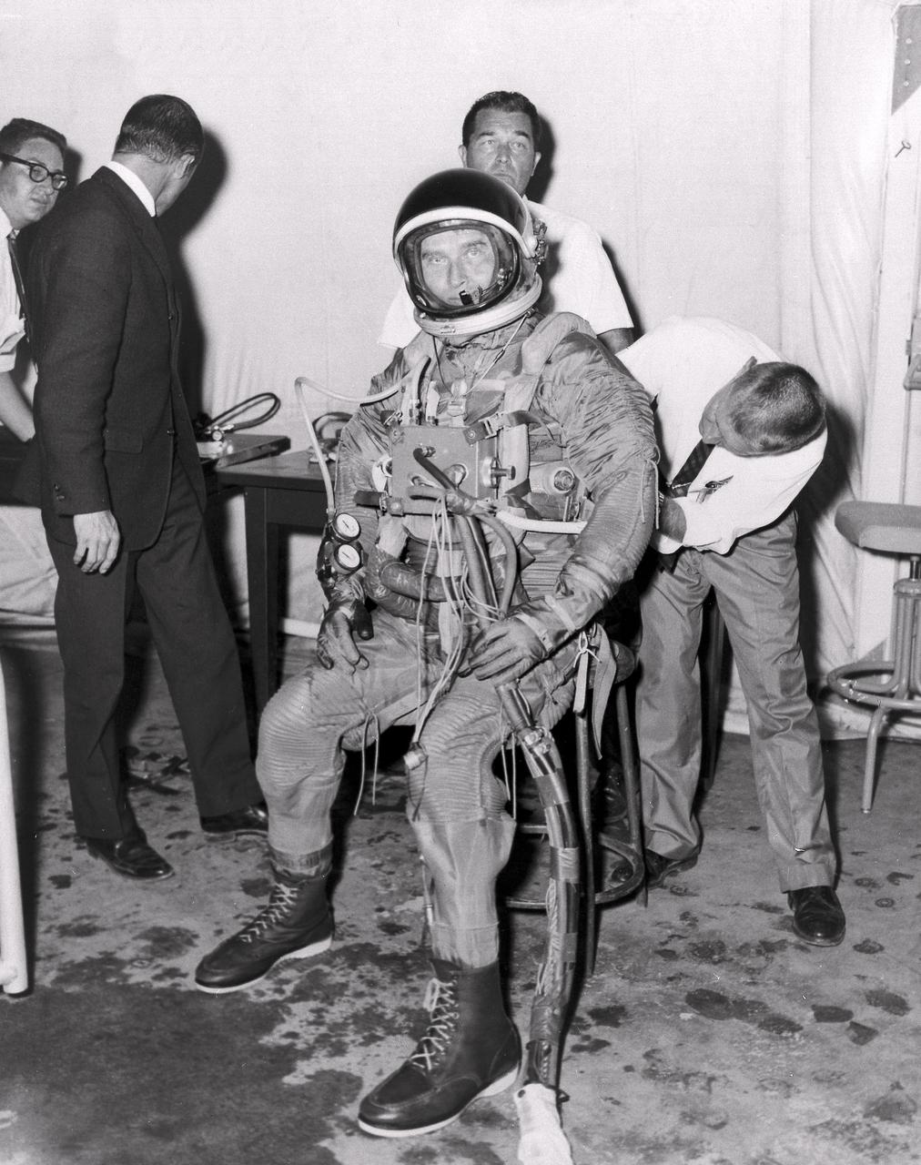 Marshall Space Flight Center (MSFC) Director, Dr. von Braun, is shown fitted with suit and diving equipment as he prepares for a tryout in the MSFC Neutral Buoyancy Simulator (NBS). Weighted to a neutrally buoyant condition, Dr. von Braun was able to perform tasks underwater which simulated weightless conditions found in space.