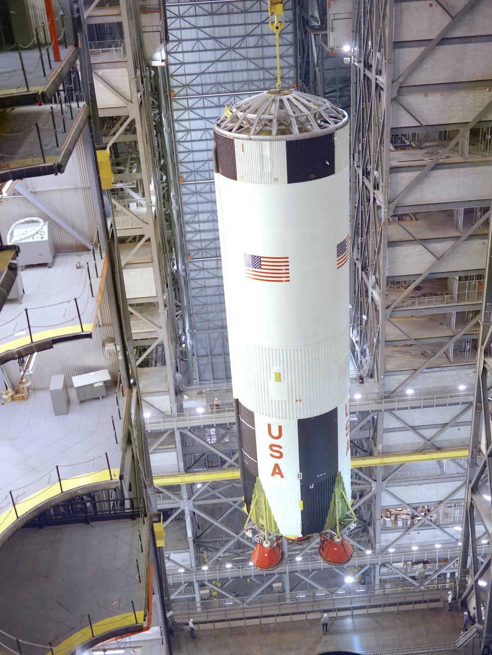 The S-IC stage being erected for the final assembly of the Saturn V launch vehicle for the Apollo 8 mission (AS-503), is photographed in the Vehicle Assembly Building (VAB) high bay at the Kennedy Space Center. The Apollo 8 mission was the first Saturn V manned mission with astronauts Frank Borman, James A. Lovell, and William Anders. They escaped Earth's gravity and traveled to lunar vicinity. The launch of Apollo 8 occurred on December 21, 1968. 