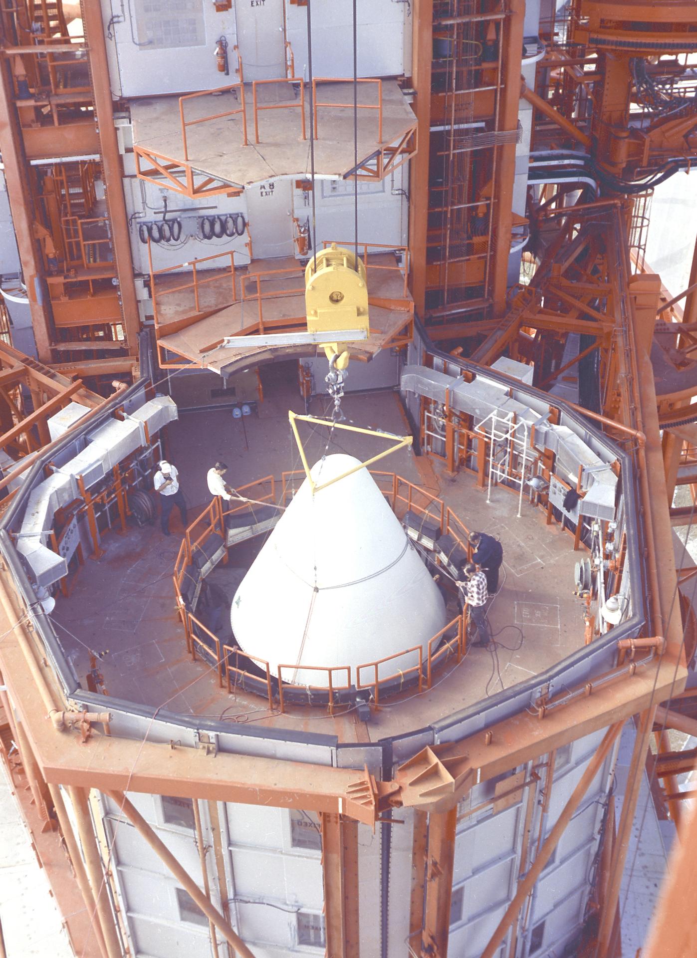 The Apollo 5 nose cone is placed prior to flight