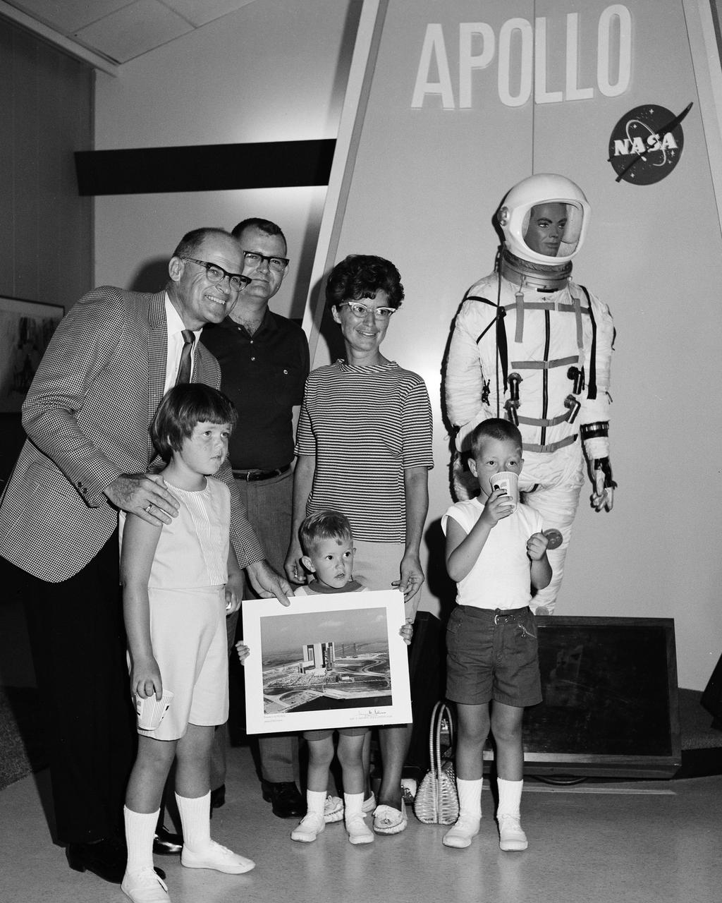 CAPE KENNEDY, Fla. -- At the Kennedy Space Center in Florida, the 500,000th visitor to take a NASA escorted bus tour, Donald A. Jackson of Sabina, Ohio, was welcomed at the new Visitor Information Center on Merritt Island by deputy center director Albert F. Siepert, left. Jackson toured the center with his wife, Sue, and their three children, Cheryl, Craig and Doug. Jackson works for the National Cash Register Co. The 500,000th visitor was recorded less than an hour after the Visitor Information Center was officially opened to the public at 8:45 a.m. The NASA tours were begun July 22, 1966, and since that time visitors from every state in the nation and more than 60 nations have toured the space center. Photo Credit: NASA