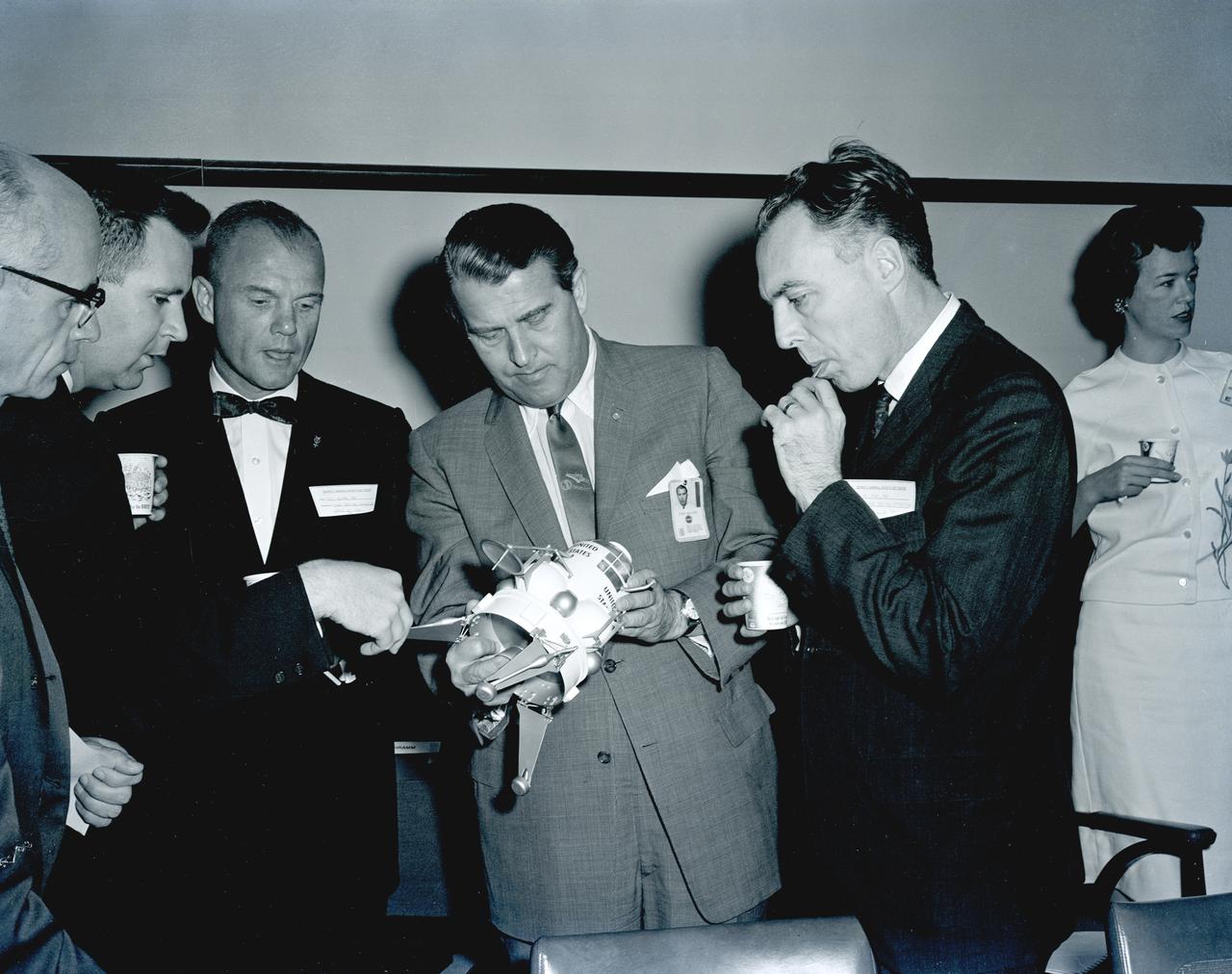 Dr. von Braun (right) and Astronaut John Glenn examine a model of a lunar landing stage during a talk on the manned lunar exploration program by about sixty key officials of the nation's space program at the Marshall Space Flight Center (MSFC).