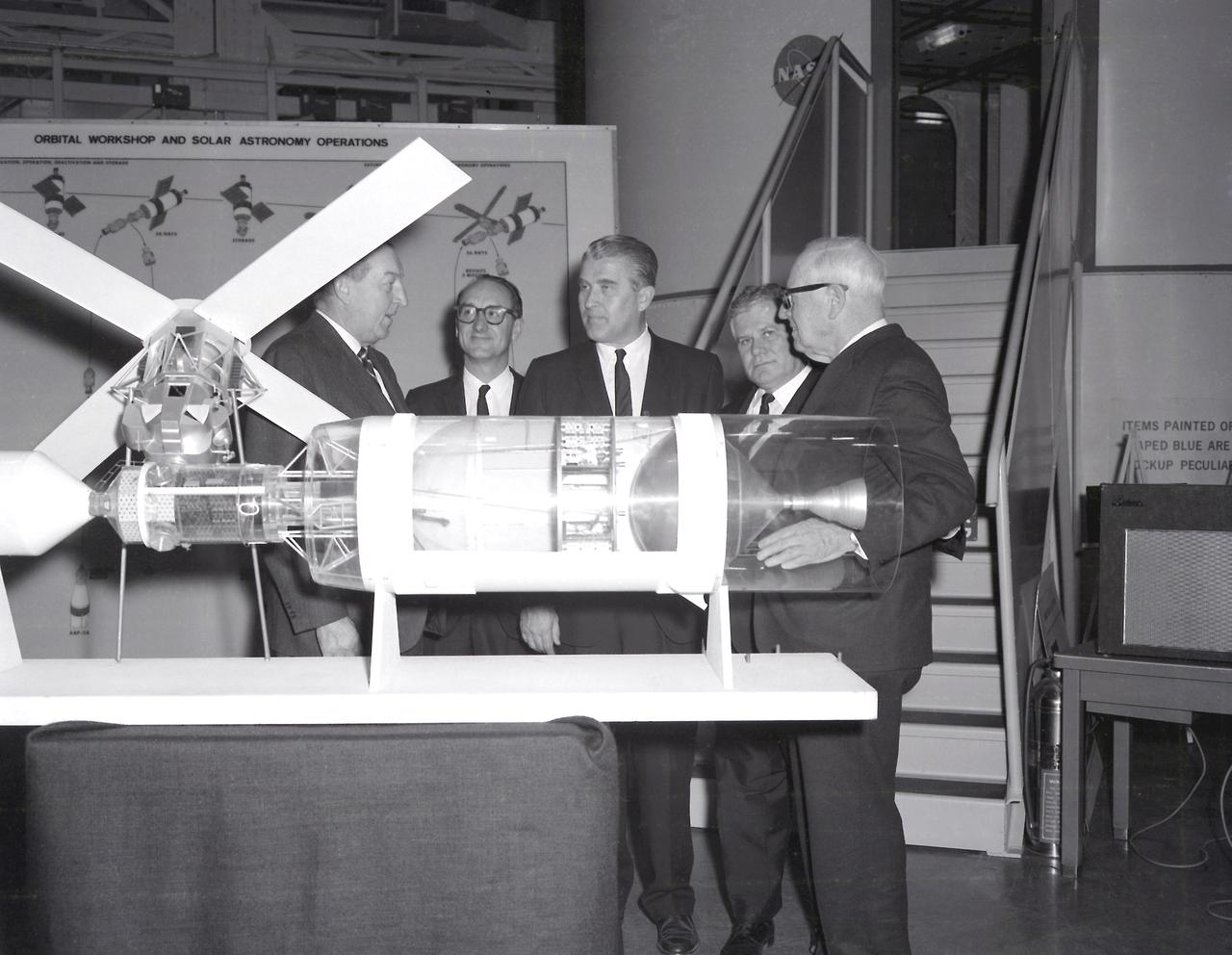 Congressman Jones; Dr. George Mueller, Associate Director for Marned Space Flight; Dr. von Braun, Director, MSFC; Congressman Teague; and Congressman Miller discussing the S-IV-B Workshop during the congressmen's visit to the Marshall Space Flight Center (MSFC) on February 22, 1968. 
