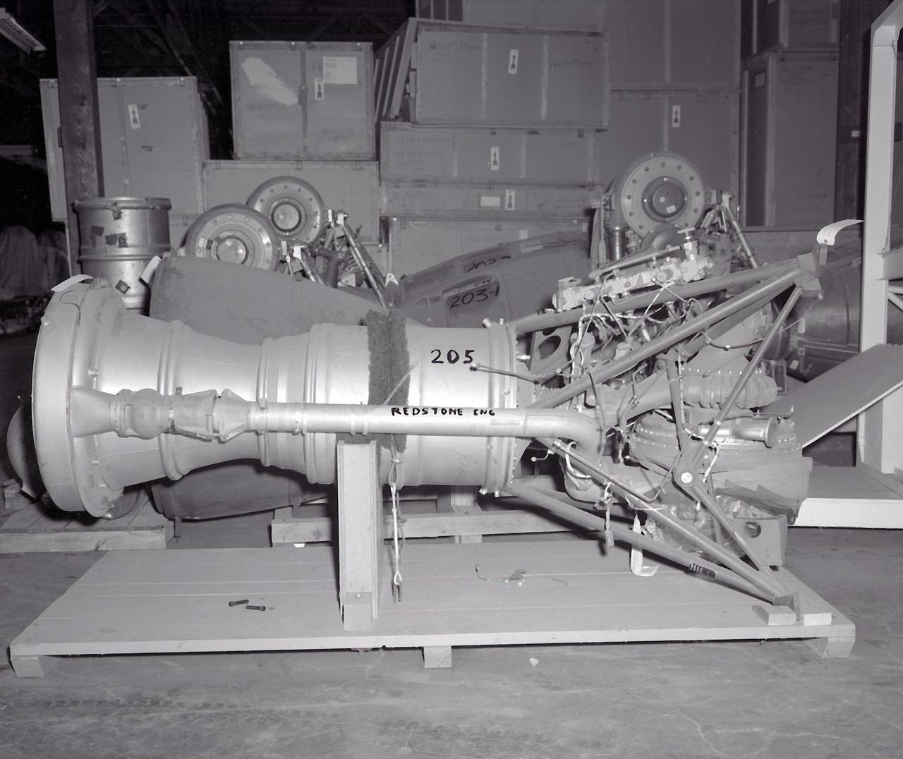 This photograph is of the engine for the Redstone rocket. The Redstone ballistic missile was a high-accuracy, liquid-propelled, surface-to-surface missile developed by the Army Ballistic Missile Agency, Redstone Arsenal, in Huntsville, Alabama, under the direction of Dr. von Braun. The Redstone engine was a modified and improved version of the Air Force's Navaho cruise missile engine of the late forties. The A-series, as this would be known, utilized a cylindrical combustion chamber as compared with the bulky, spherical V-2 chamber. By 1951, the Army was moving rapidly toward the design of the Redstone missile, and the production was begun in 1952. Redstone rockets became the "reliable workhorse" for America's early space program. As an example of its versatility, the Redstone was utilized in the booster for Explorer 1, the first American satellite, with no major changes to the engine or missile.