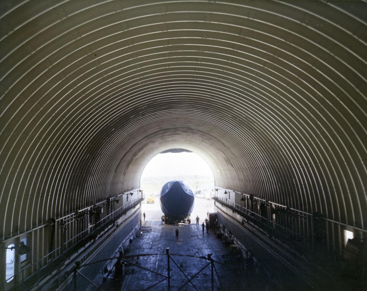 The Saturn 1B first stage (S-IB) enters the NASA barge Point Barrow, in March 1968. The Marshall Space Flight Center (MSFC) utilized a number of water transportation craft to transport the Saturn stages to-and-from the manufacturing facilities and test sites, as well as delivery to the Kennedy Space Center for launch. Developed by the Marshall Space Flight Center and built by the Chrysler Corporation at Michoud Assembly Facility (MAF), the S-IB utilized the eight H-1 engines and each produced 200,000 pounds of thrust, a combined thrust of 1,600,000 pounds.